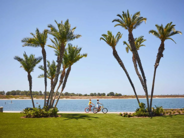 Two cyclists riding around Mission Bay in San Diego